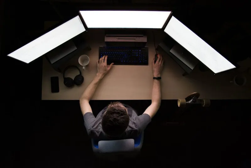 programmer with three screens
